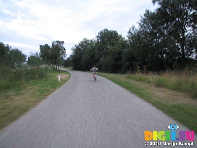 SX15530 Jenni riding her bike back to the campervan